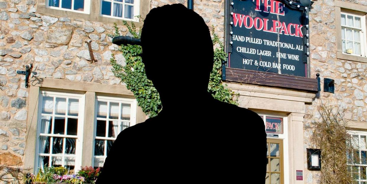 male silhouette in front of the woolpack pub in emmerdale