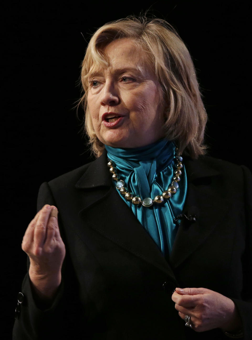 Former Secretary of State Hillary Rodham Clinton speaks to the National Automobile Dealers Association meeting in New Orleans, Monday, Jan. 27, 2014. (AP Photo/Gerald Herbert)