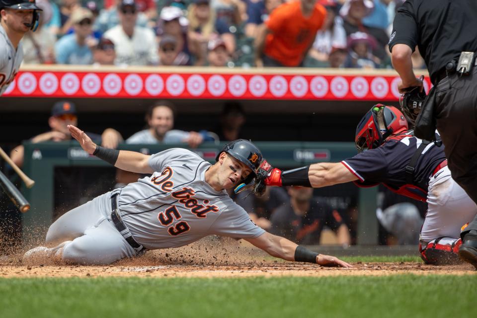 Detroit Tigers third baseman Zack Short (59) is tagged out at home plate by Minnesota Twins catcher Ryan Jeffers (27) during the fifth inning at Target Field in Minneapolis on Saturday, June 17, 2023.