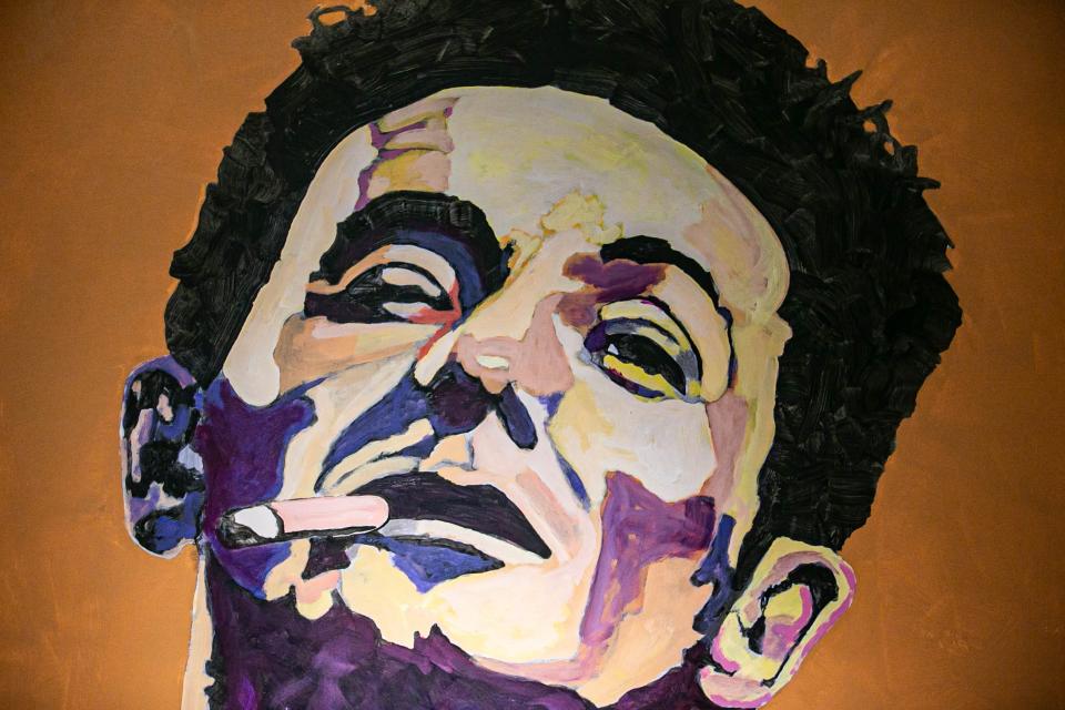 A Painting of Woody Guthrie is pictured at the Woody Guthrie Center in Tulsa on Saturday, May 7, 2022.