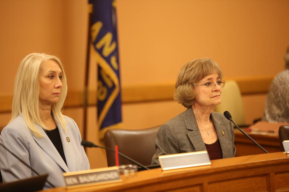 Sens. Renee Erickson, R-Wichita, and Beverly Gossage, R-Eudora, listen to testimony on a bill banning gender-affirming care for minors Tuesday in the Senate Public Health and Welfare Committee.