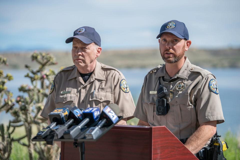 Park Manager Joseph Stadterman, right, speaks during a press conference about a shooting that left two dead at Lake Pueblo State Park's Sailboard Beach on Friday, June 21, 2024.