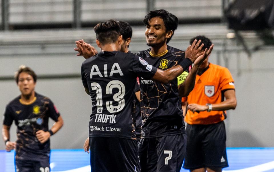 Tampines captain Yasir Hanapi (right) celebrates scoring against DPMM FC in their Singapore Premier League match. (PHOTO: SPL)