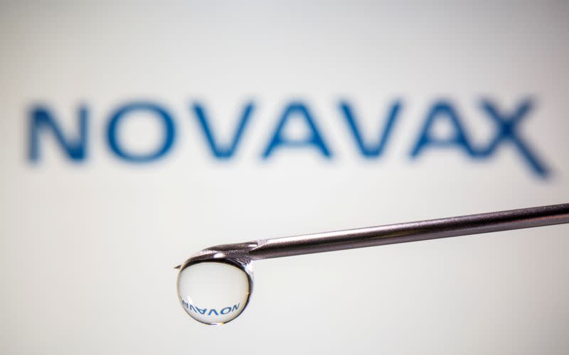 FILE PHOTO: A Novavax logo is reflected in a drop on a syringe needle in this illustration