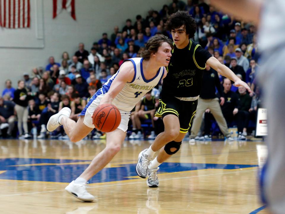 Alex Bobb drives on Ryan Lamonica during Maysville's 61-56 win against visiting Tri-Valley earlier this season. Bobb was tabbed the Division II Boys Co-Player of the Year in the East District by district members of the Ohio Prep Sportswriters Association.