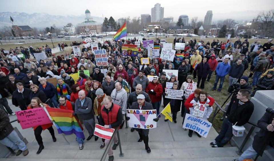 Supporters of gay marriage gather for a rally at the Utah State Capitol, Tuesday, Jan. 28, 2014, in Salt Lake City. Opponents and supporters of gay marriage held twin rallies at the Capitol on Tuesday. More than 1,000 gay couples rushed to get married when a federal judge overturned Utah's constitutional amendment banning same-sex marriage in late December 2013. In early January the U.S. Supreme Court granted Utah's request for an emergency halt to the weddings. (AP Photo/Rick Bowmer)