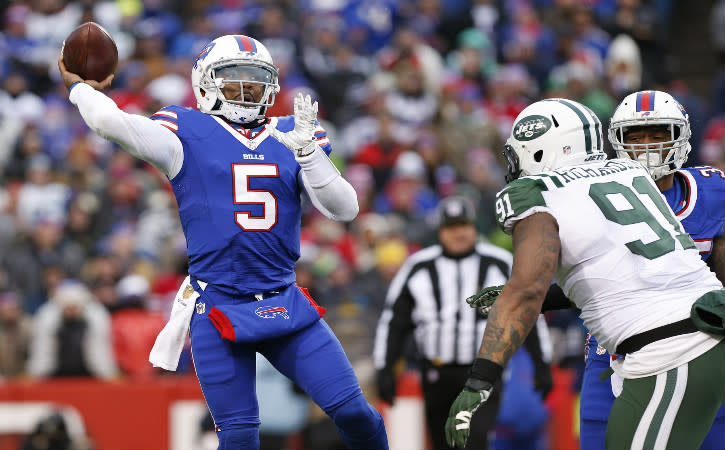 Jan 3, 2016; Orchard Park, NY, USA; Buffalo Bills quarterback Tyrod Taylor (5) throws a pass under pressure by New York Jets defensive end Sheldon Richardson (91) during the second half at Ralph Wilson Stadium. Bills beat the Jets 22-17. Mandatory Credit: Kevin Hoffman-USA TODAY Sports