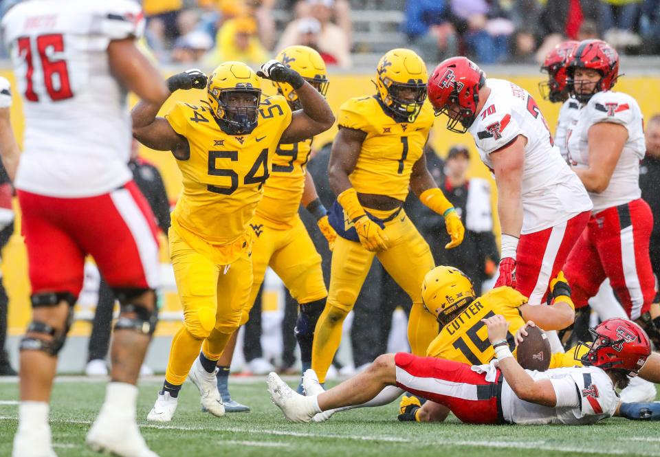 West Virginia's defensive lineman Fatorma Mulbah (54) celebrates after a defensive stop against Texas Tech, Saturday, Sept. 23, 2023, at Milan Puskar Stadium, in Morgantown, West Virginia.