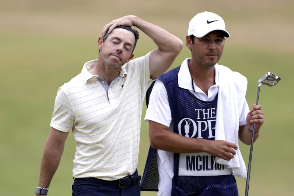 Rory McIlroy (left) looks dejected after finishing third in the 150th Open at St Andrews (PA Wire)