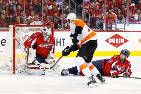 Apr 16, 2016; Washington, DC, USA; Washington Capitals goalie Braden Holtby (70) makes a save on Philadelphia Flyers right wing Wayne Simmonds (17) in the second period in game two of the first round of the 2016 Stanley Cup Playoffs at Verizon Center. Mandatory Credit: Geoff Burke-USA TODAY Sports
