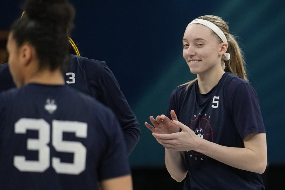 UConn's Paige Bueckers claps during a practice session for a college basketball game in the semifinal round of the Women's Final Four NCAA tournament Thursday, March 31, 2022, in Minneapolis. (AP Photo/Eric Gay)