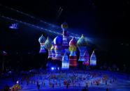 <p>Inflatable figures representing St. Basil's cathedral drift in the air above dancers. </p>