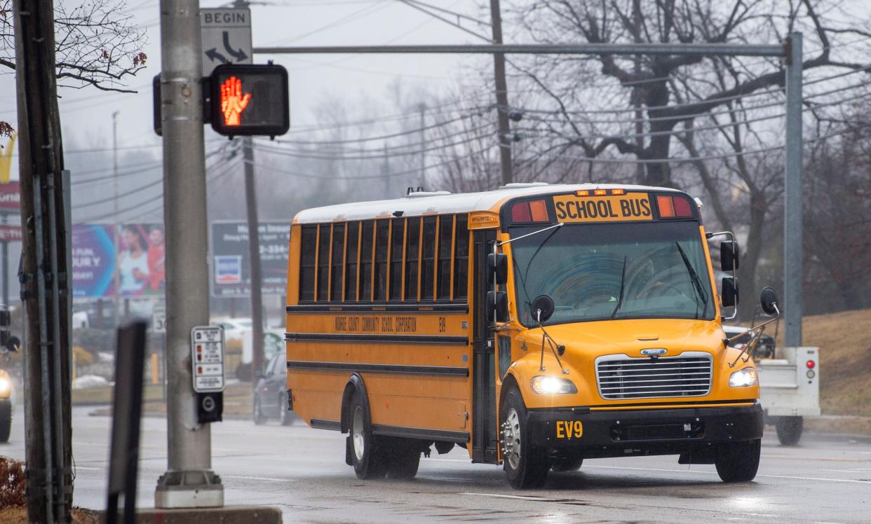 An electric school bus heads down Walnut Street towards Bloomington High School South on Tuesday, Jan. 23, 2024.