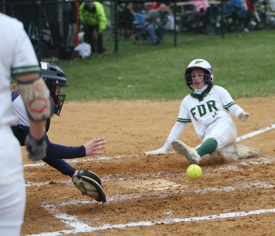 Franklin D. Roosevelt's Aliya Feerick slides into home plate during Monday's game versus Burke Catholic on April 18, 2022. 