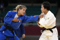 Odette Giuffrida of Italy, left, and Uta Abe of Japan compete during their women's -52kg semifinal judo match at the 2020 Summer Olympics, Sunday, July 25, 2021, in Tokyo, Japan. (AP Photo/Vincent Thian)