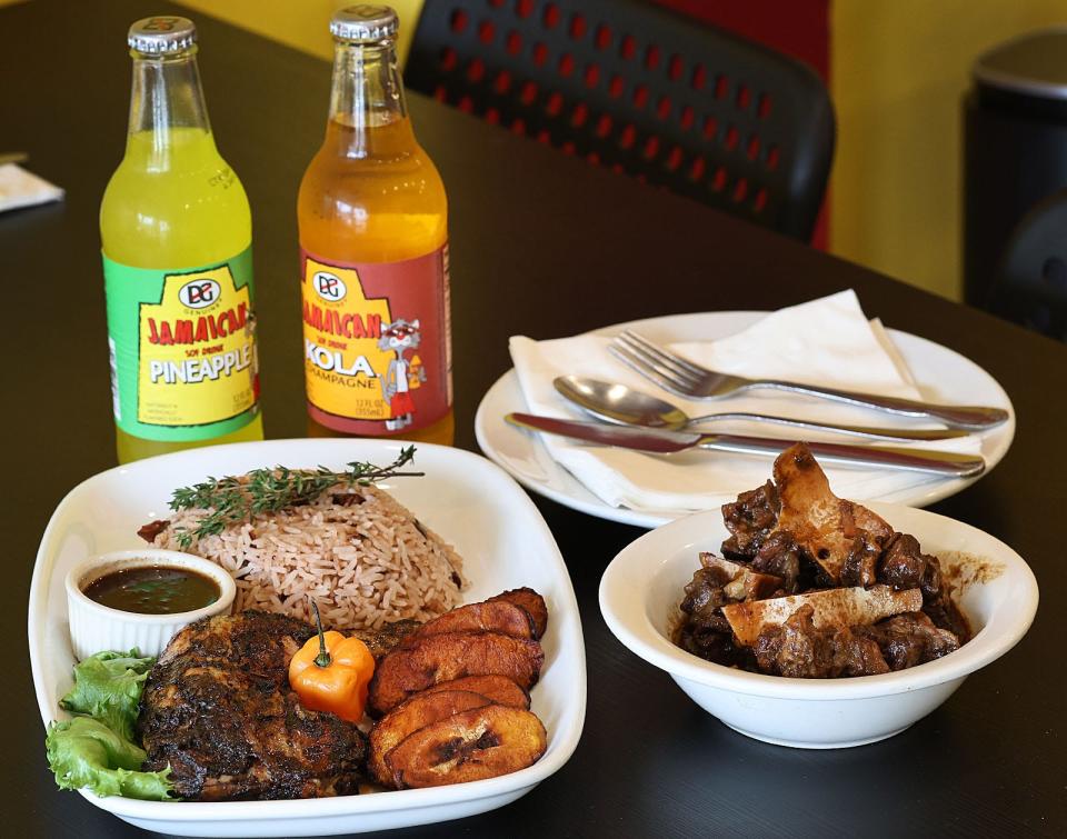 Jerk chicken with plantains and brown rice, left, and oxtail stew are two of the Jamaican offerings from Bright Light Authentic Jamaican & Filipino Cuisine on Water Street in Quincy.