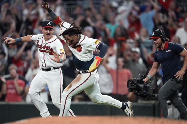 Atlanta Braves' Ronald Acuna Jr. (13) blows a bubble after he hit a two-run  home run during the fifth inning of the team's baseball game against the  Miami Marlins on Friday, Aug.