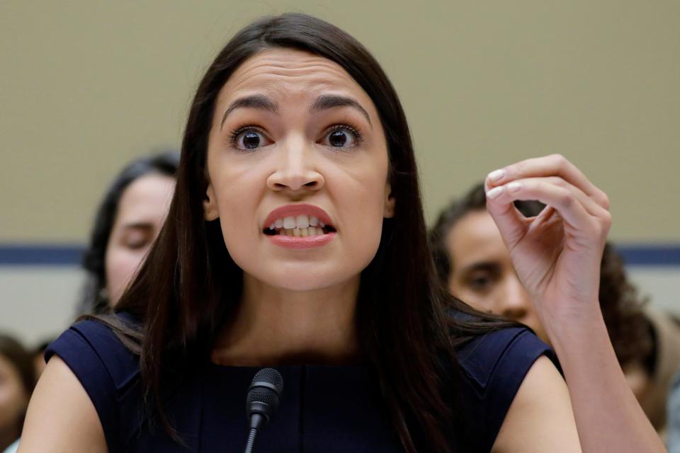 Rep. Alexandria Ocasio-Cortez, D-N.Y., gestures while testifying before the House Oversight Committee hearing on family separation and detention centers, on Capitol Hill in Washington, July 12, 2019.