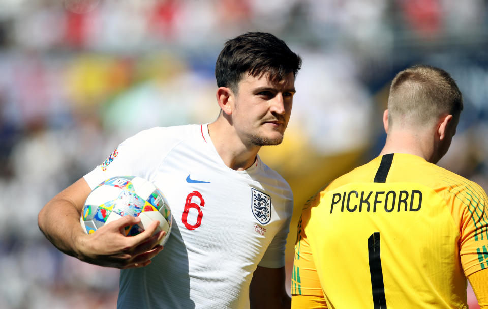 England's Harry Maguire (left) and goalkeeper Jordan Pickford (right) during the Nations League Third Place Play-Off at Estadio D. Alfonso Henriques, Guimaraes.