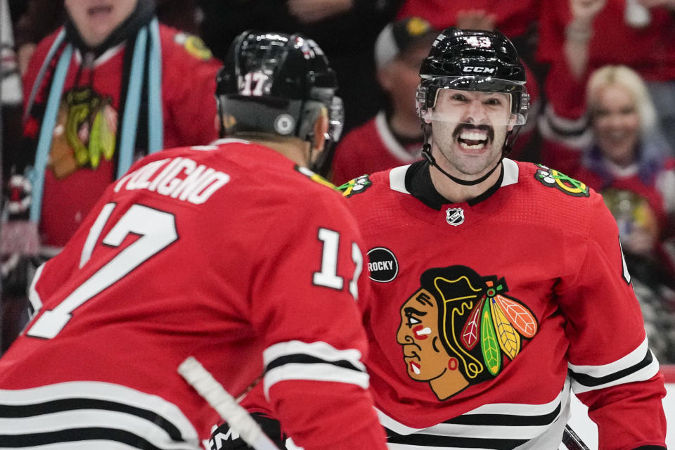 Chicago Blackhawks center Colin Blackwell reacts after center Jason Dickinson scored against the Montreal Canadiens during the second period of an NHL hockey game Friday, Dec. 22, 2023, in Chicago. (AP Photo/Erin Hooley)