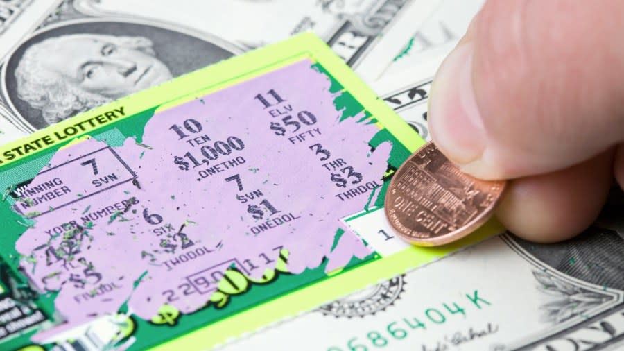 A lottery scratchers ticket and cash are seen in a file photo. (iStock/Getty Images Plus)