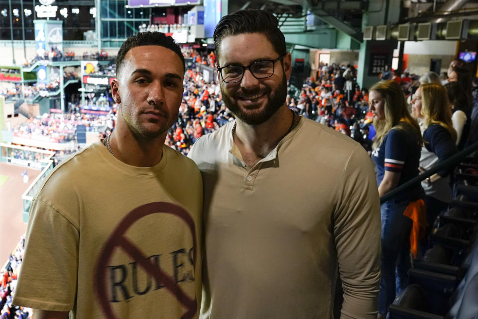 Jack Flaherty, left, of Cardinals and Lucas Giolito of White Sox pose before Game 6 of baseball's World Series between the Houston Astros and the Atlanta Braves Tuesday, Nov. 2, 2021, in Houston. (AP Photo/Ashley Landis)