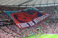 TOPSHOTS Russia's football fans display a giant banner during the Euro 2012 championships football match Poland vs Russia on June 12, 2012 at the National Stadium in Warsaw. AFP PHOTO / DIMITAR DILKOFFDIMITAR DILKOFF/AFP/GettyImages