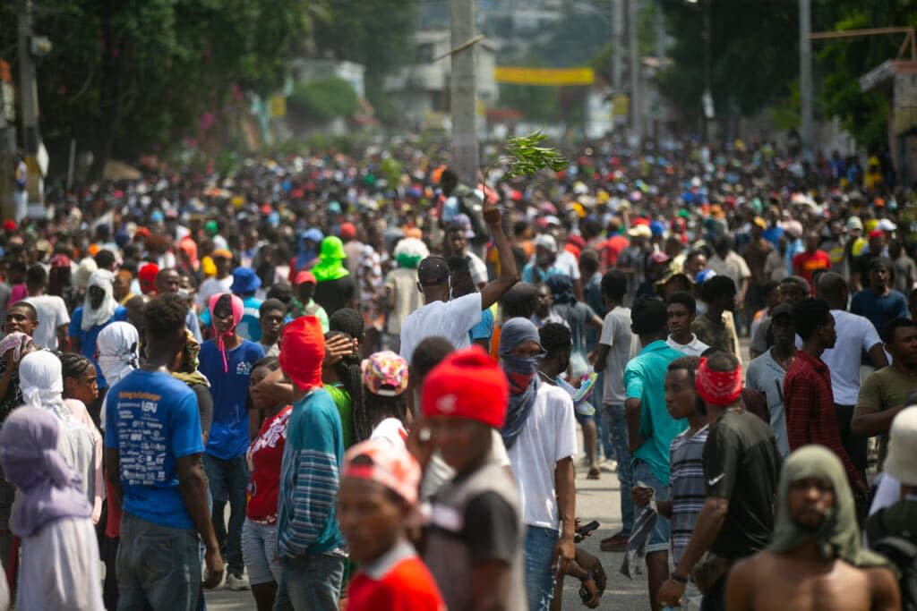 Demonstrators fill the streets during a protest to demand the resignation of Prime Minister Ariel Henry, in the Petion-Ville area of Port-au-Prince, Haiti, Monday, Oct. 3, 2022. (AP Photo/Odelyn Joseph)