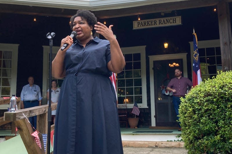 Georgia Democratic candidate for governor Stacey Abrams speaks on July 28, 2022, during a rally in Clayton, Ga. Abrams is launching an intensive effort to get out the vote by urging potential supporters to cast in-person ballots the first week of early voting as she tries to navigate the state’s new election laws.