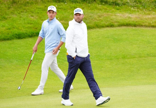 England’s Daniel Brown, right, walks on the 6th green