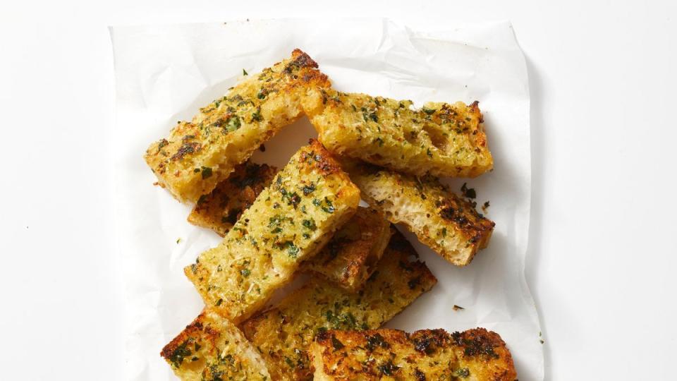 cheesy garlic bread in a pile