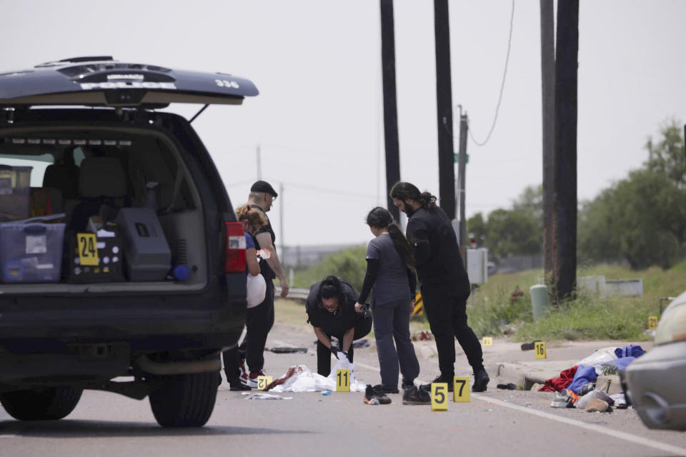 FILE - Emergency personnel respond to a fatal collision in Brownsville, Texas, on Sunday, May 7, 2023. fter they were struck by a vehicle while waiting at a bus stop near Ozanam Center, a migrant and homeless shelter. A Texas jury has found George Alvarez guilty of intoxication manslaughter, Friday, June 28, 2024 over the deaths of eight people who were struck by an SUV that plowed into a crowded bus stop outside a migrant shelter on the U.S.-Mexico border. (AP Photo/Michael Gonzalez, File)