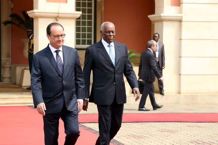 French President Francois Hollande and Angolan President Jose Eduardo dos Santos walk to a news conference in Luanda, July 3, 2015. REUTERS/Herculano Coroado