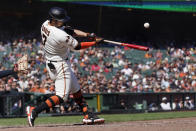 San Francisco Giants' J.D. Davis hits a three-run home run against the Cleveland Guardians during the eighth inning of a baseball game in San Francisco, Wednesday, Sept. 13, 2023. (AP Photo/Jeff Chiu)