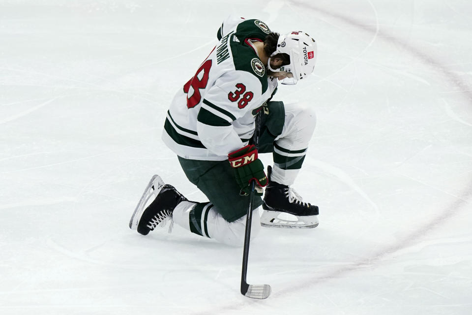 Minnesota Wild right wing Ryan Hartman celebrates his goal against the Chicago Blackhawks during the first period of an NHL hockey game in Chicago, Friday, Jan. 21, 2022. (AP Photo/Nam Y. Huh)