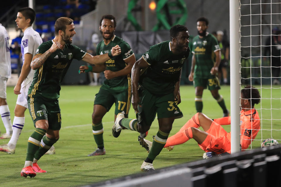 REUNION, FLORIDA - AUGUST 11: Larrys Mabiala #33 of Portland Timbers celebrates after scoring the opening goal of the final match of MLS Is Back Tournament between Portland Timbers and Orlando City at ESPN Wide World of Sports Complex on August 11, 2020 in Reunion, Florida. (Photo by Sam Greenwood/Getty Images)