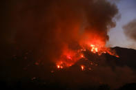 <p>Flames flare up from a wildfire near Placenta Canyon Road in Santa Clarita, Calif., July 24, 2016. (AP Photo/Ringo H.W. Chiu)</p>