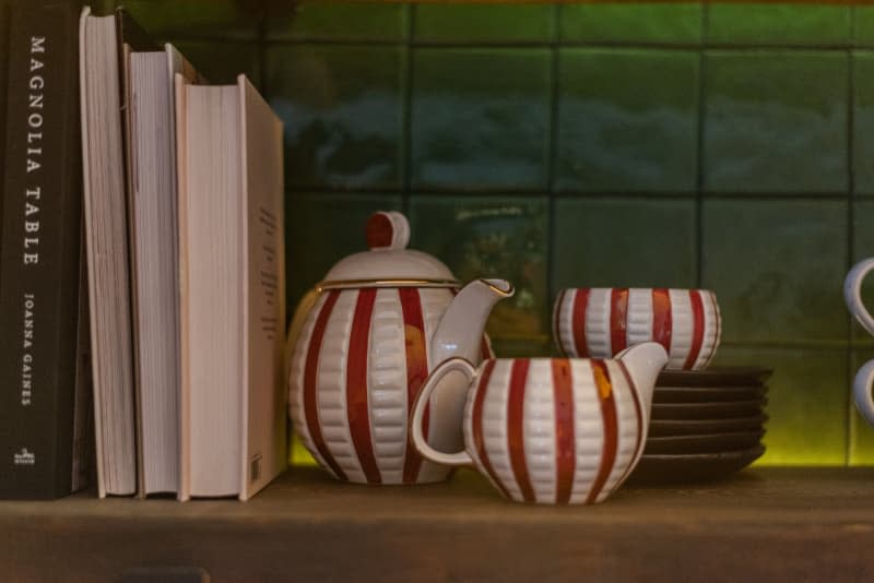 Red and white tea kit on a shelf.