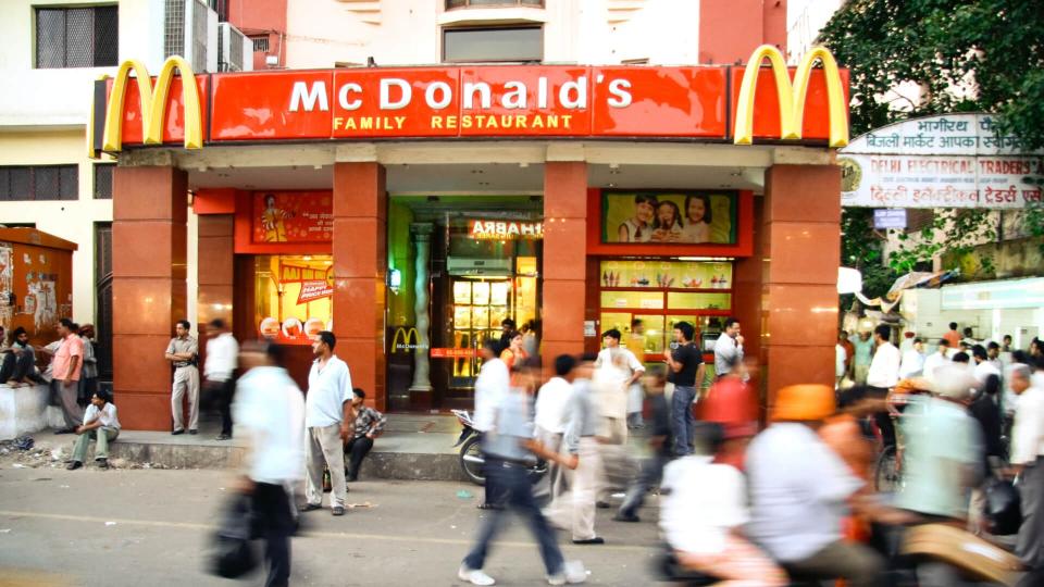 DELHI - SEPTEMBER 15: Crowds passing in front of McDonald's on September 15, 2007 in Delhi, India. It's the only country in the world that does not offer beef on its menu.