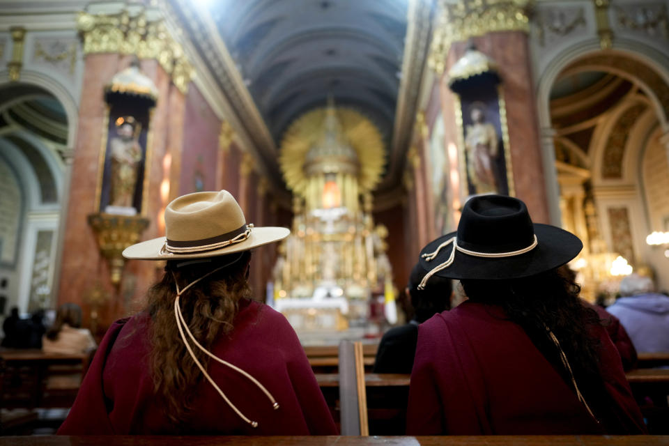 Women wait for the start of Mass at the Cathedral in Salta, Argentina, Monday, May 2, 2022. Eighteen cloistered nuns from the San Bernardo Convent in Salta province have made a formal allegation against the Archbishop Mario Cargnello of Salta and two other members of the church for alleged physical and psychological gender violence. (AP Photo/Natacha Pisarenko)