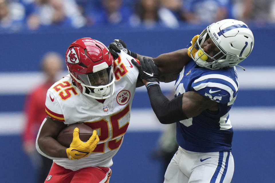 Kansas City Chiefs running back Clyde Edwards-Helaire (25) is tackled by Indianapolis Colts' Rodney McLeod (26) during the second half of an NFL football game, Sunday, Sept. 25, 2022, in Indianapolis. (AP Photo/AJ Mast)