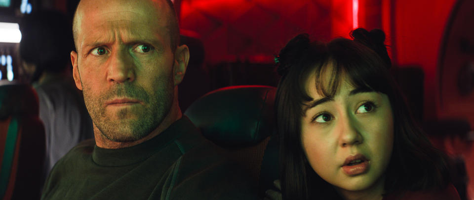 This image released by Warner Bros. Pictures shows Jason Statham, left, and Sophia Cai in a scene from "Meg 2: The Trench." (Warner Bros. Pictures via AP)