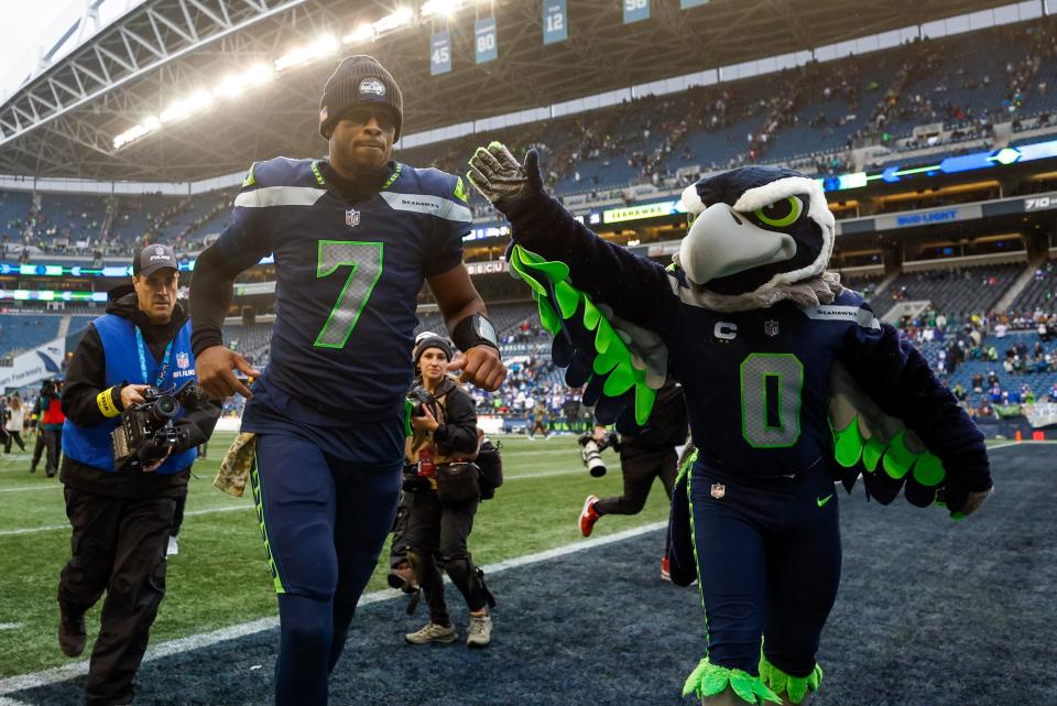 Seattle Seahawks quarterback Geno Smith jogs off the field following a 27-13 victory against the New York Giants at Lumen Field.