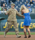 <p>Army Specialist Wes Wooten of Maryville, Missouri returns from Afghanistan to surprise his sister Mataya Wooton before a game between the Los Angeles Angels of Anaheim and the Kansas City Royals at Kauffman Stadium on September 15, 2012 in Kansas City, Missouri. (Photo by Tim Umphrey/Getty Images) </p>