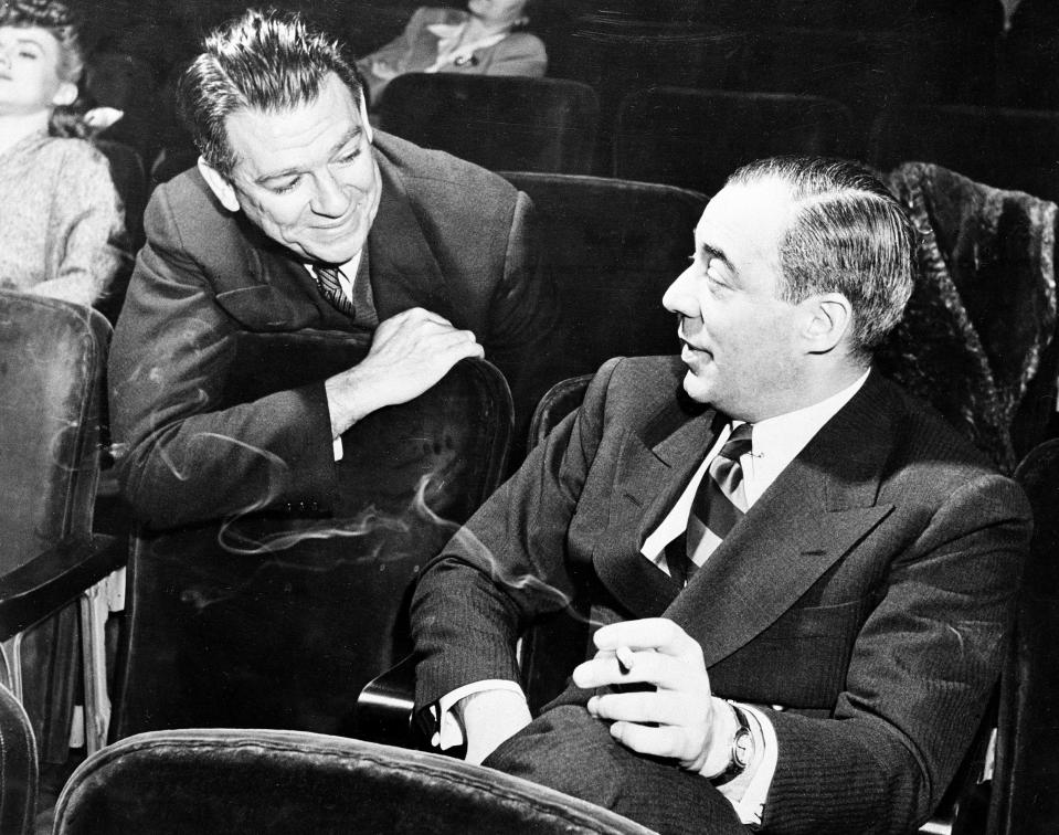 Librettist Oscar Hammerstein II, left, and composer Richard Rodgers talk inside a theater in May 1944 at an unknown location. Rodgers and Hammerstein were awarded a special Pulitzer Prize in 1943 for the operetta "Oklahoma!"  The successful Broadway musical was their first collaboration, with music by Rodgers and lyrics and book by Hammerstein.