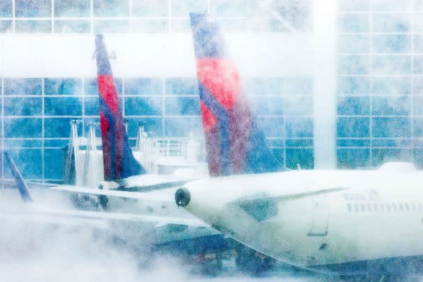 PHOTO: Delta airplanes sit at their gates during a winter storm at Denver International Airport, Feb. 22, 2023 in Denver. (Michael Ciaglo/Getty Images)