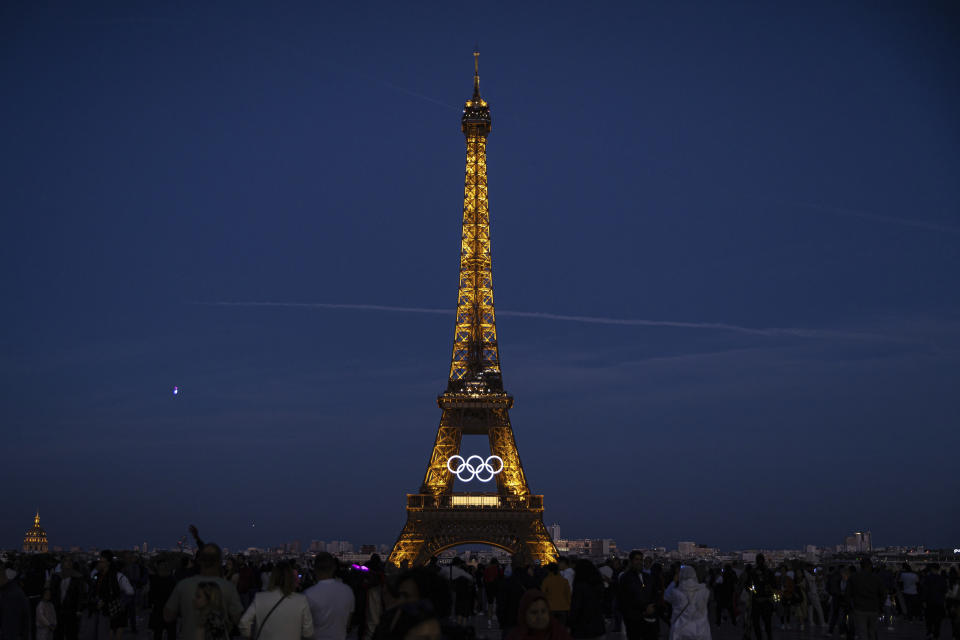 The Olympic rings are seen on the Eiffel Tower Friday, June 7, 2024, in Paris. The Paris Olympics organizers mounted the rings on the Eiffel Tower on Friday as the French capital marks 50 days until the start of the Summer Games. The 95-foot-long and 43-foot-high structure of five rings, made entirely of recycled French steel, will be displayed on the south side of the 135-year-old historic landmark in central Paris, overlooking the Seine River. (AP Photo/Aurelien Morissard)