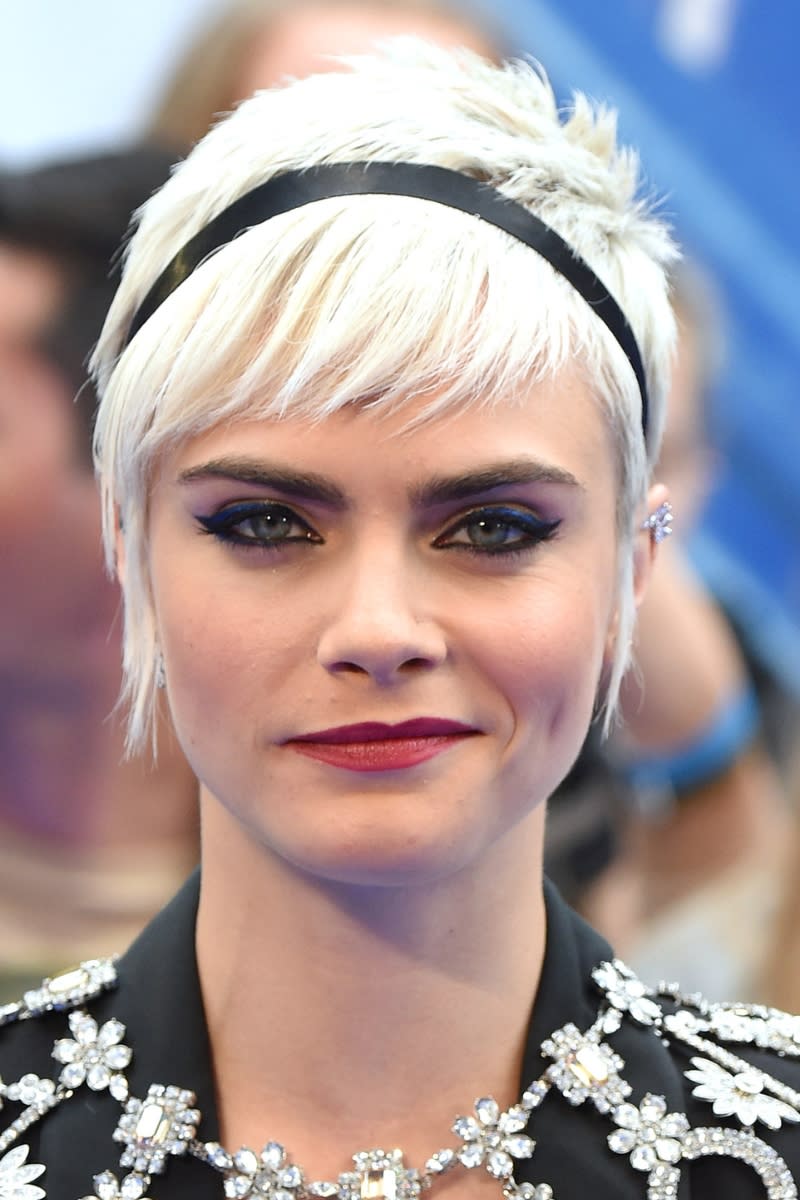 Cara Delevingne has a bleach blonde pixie cut at the 