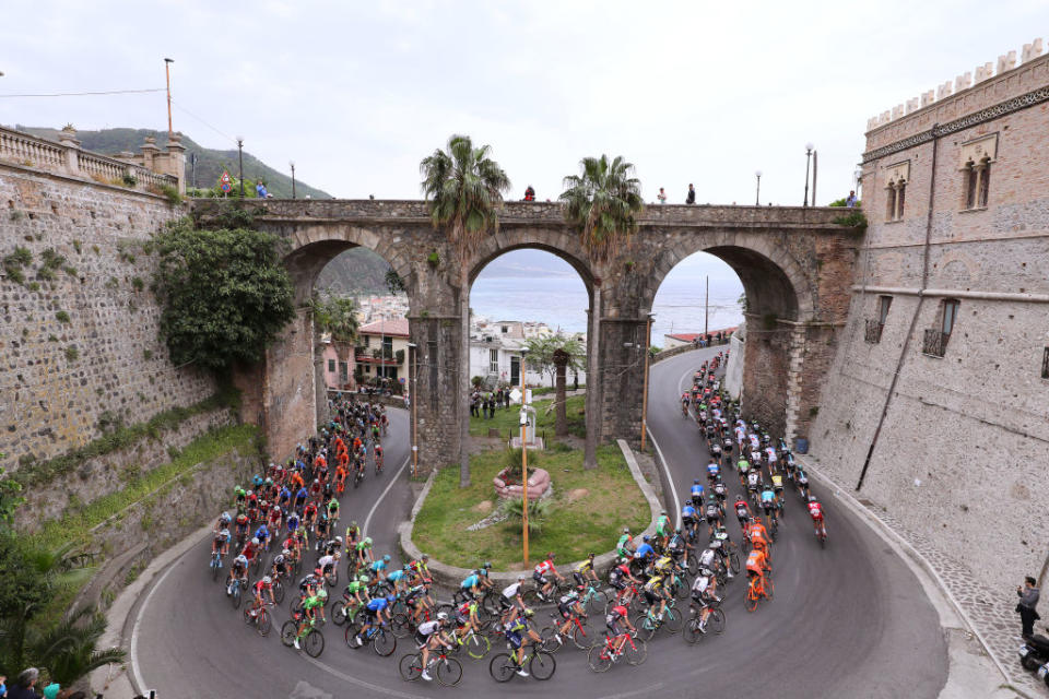 <p>The peloton of the 100th Giro, under an unconventional bridge in the sixth stage, Reggio Calabria – Terme Luigiane (217km). </p>