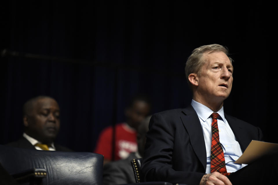 Democratic presidential contender Tom Steyer listens during a scripture reading at an NAACP rally, Sunday, Jan. 19, 2020, at South Carolina State University in Orangeburg, S.C. (AP Photo/Meg Kinnard)